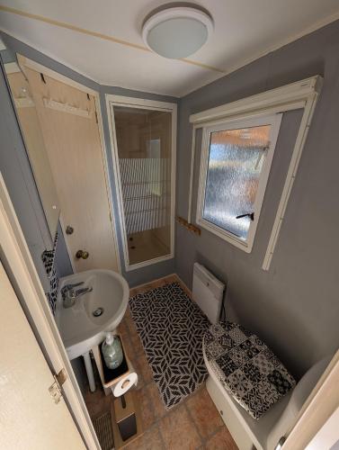 a small bathroom with a sink and a shower at Beach Resort Kamperland - 1747 in Kamperland