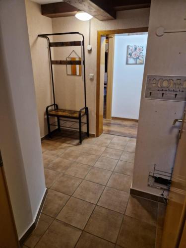 a hallway with a room with a tiled floor at Alex Meißner App 2 in Großalmerode