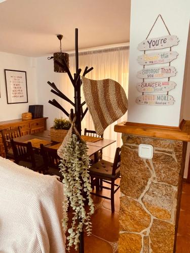 a living room with a table with a christmas tree at Villa EMMA - Chalet familiar con jardín y parking en Málaga in Málaga