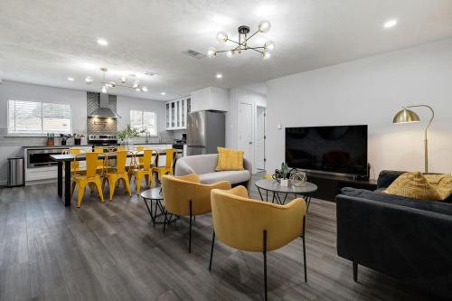 a living room with a dining room and a kitchen at Upscale 3BR 2BA Cozy Holiday Home with Pool & Grill in North Richland Hills