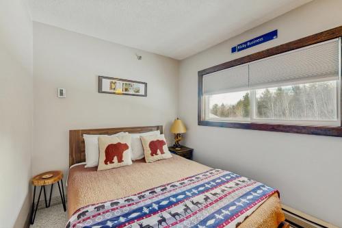 a bedroom with a large bed and a window at Fall Line W212 in Newry