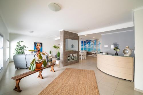 a living room with a couch and a table at Bella Luna Bed and Breakfast in Walvis Bay