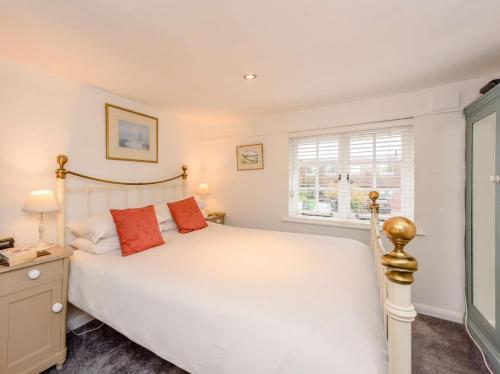a bedroom with a large white bed and a window at 1 Bed in Tenterden oc-66342 in Tenterden
