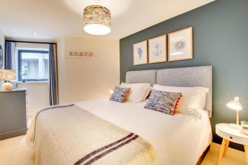 a bedroom with a large bed with two pillows at 2 Bed in West Bay oc-wy487 in West Bay