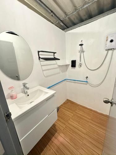 a bathroom with a sink and a mirror at Moon house Beach Hostel in Haad Rin