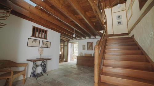 a staircase in a house with wooden ceilings at Casa La Monja in Garachico