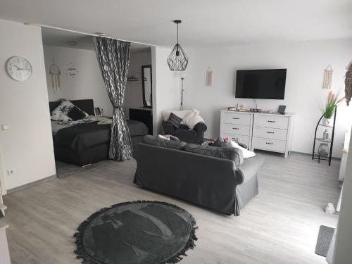 a living room with a couch and a bed at Sweet Home in Hameln