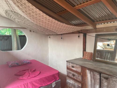 a room with a bed and a window in a trailer at Sunflower Cottage near Ojo de Agua in Las Pilas