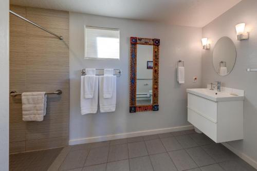 a bathroom with a sink and a mirror at The Entrada Flat 1 in Moab UT in Moab