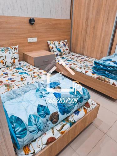 Llit o llits en una habitació de Paradis résidence433
