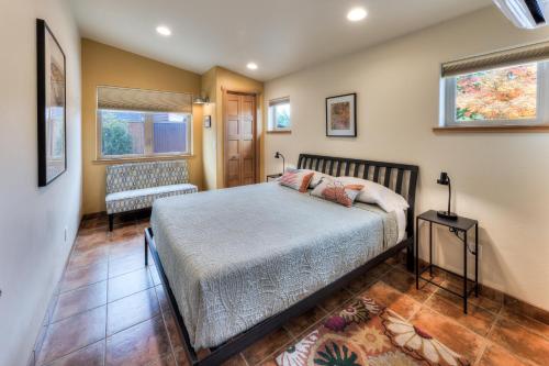 a bedroom with a bed and a chair in it at The Wingate Flat 4 in Moab