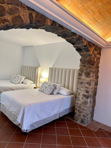 Llit o llits en una habitació de Villa Manantial