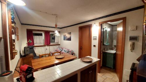 a kitchen with a wooden counter top in a room at Dolce Vista in Passo del Tonale