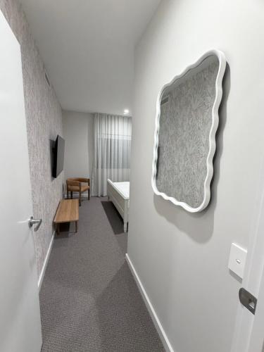 a room with a mattress hanging on the wall at 24 Bromley St private room in a luxurious shared apt in Brisbane