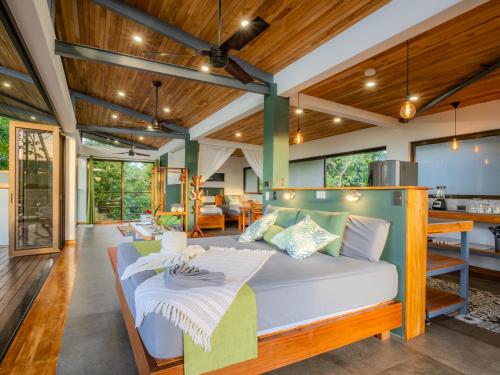 a living room with a couch and a kitchen at Southern Drake Lodge in Drake