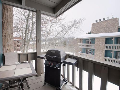 a grill on the balcony of a building at Silverado I Building B Unit 204 in Winter Park