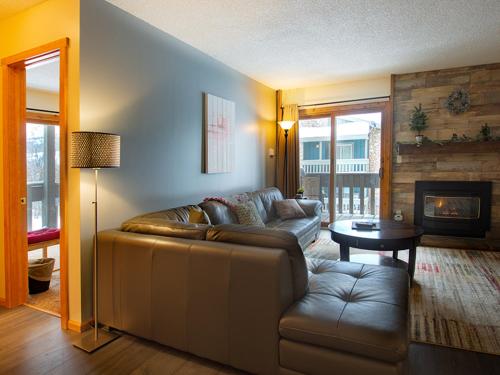 a living room with a couch and a table at Silverado I Building B Unit 204 in Winter Park