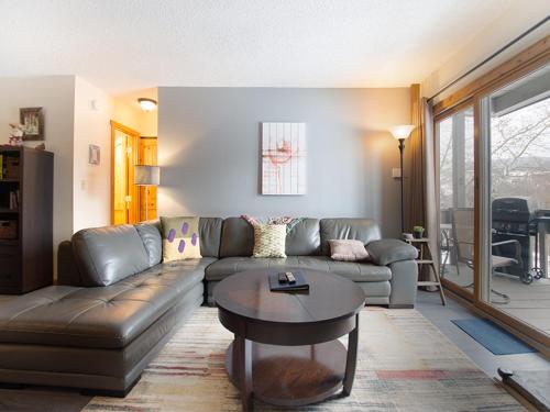 a living room with a couch and a table at Silverado I Building B Unit 204 in Winter Park