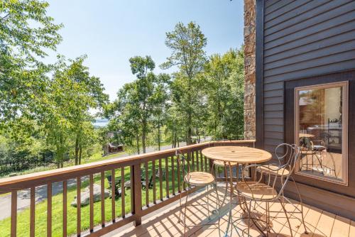 a patio with a table and chairs on a balcony at Tips Up by Railey Vacations in McHenry