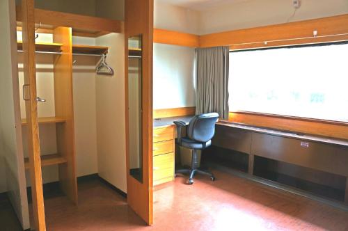 an office with a chair and a desk and a window at University of Toronto - New College Residence - Wilson Hall Residence in Toronto