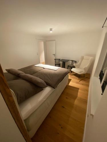 a bedroom with a bed and a table and chairs at ParkSuite Aflenz Kurort in Aflenz Kurort