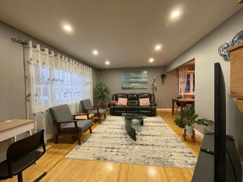 a living room with a couch and chairs at Welcome to Shibly's Retreat in Edmonton