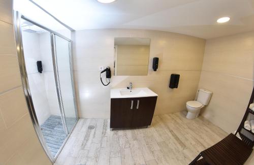 a bathroom with a sink and a toilet at Hotel Zen Airport in Torremolinos