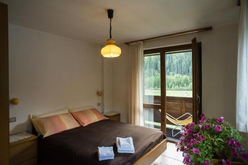 Postel nebo postele na pokoji v ubytování Residence Valfurva