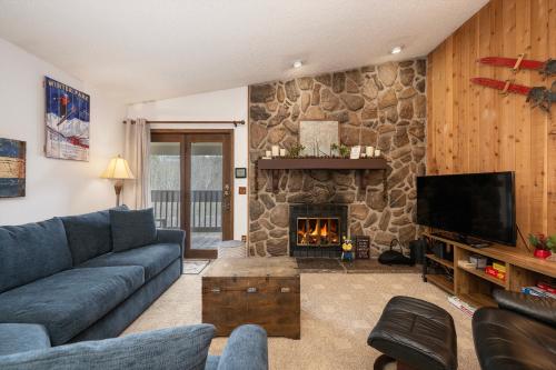 a living room with a couch and a fireplace at Silverado II Unit 334 in Winter Park