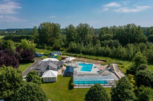 an aerial view of a resort with a swimming pool at Camping Loches in Loches