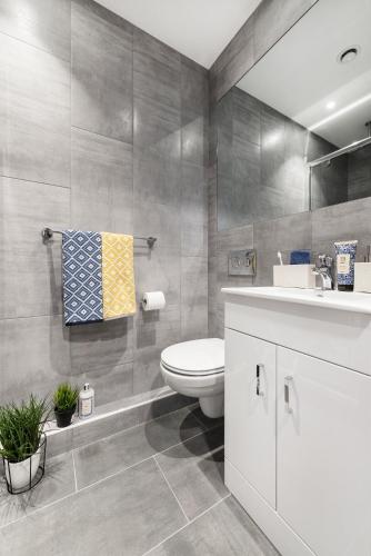 a bathroom with a toilet and a sink at Yugo Explore New Mill in Dublin
