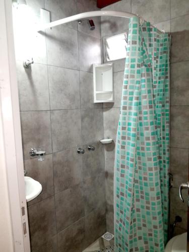 a bathroom with a shower and a sink at Alojamiento - Apart Hotel Libres - Hospedaje in Paso de los Libres