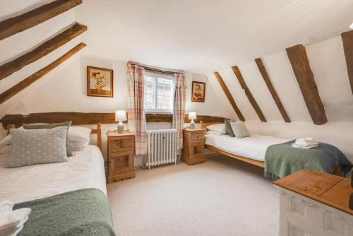 a bedroom with two beds and a window at 4 Bed in Westleton oc-holc in Westleton