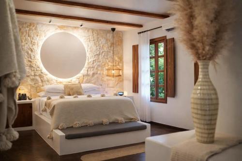 a bedroom with a large bed and a vase at Vayu Retreat Villas in Coronado