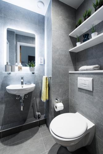 a bathroom with a white toilet and a sink at Yugo Explore - Kavanagh Court in Dublin