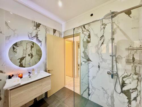 a bathroom with a sink and a shower at Villa Sunlight Sidari with private pool by DadoVillas in Sidari