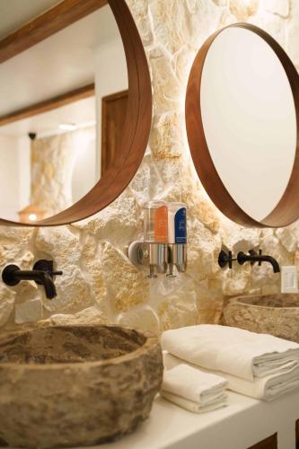 a bathroom with two sinks and a mirror at Vayu Retreat Villas in Coronado