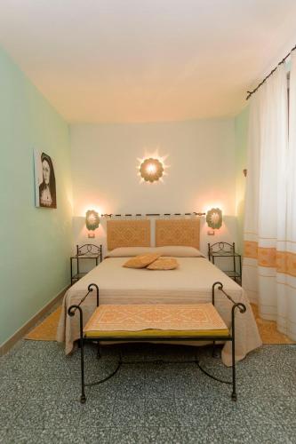 a bedroom with a bed in a room at Al Vecchio Corso B&B in Tempio Pausania
