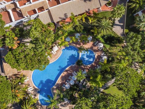 an overhead view of a pool at a resort at Ria Park Garden Hotel in Vale do Lobo