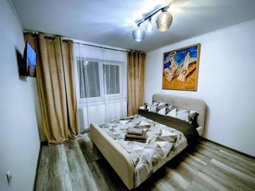 a bedroom with a bed and a window at Modern Studio AFI Arad Self Check-in in Arad
