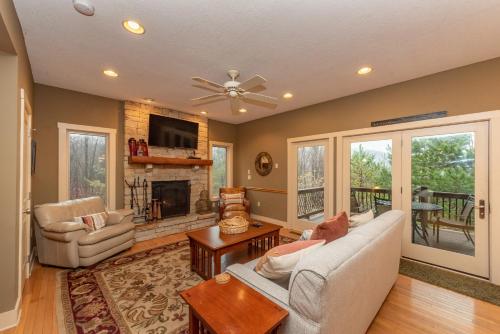 a living room with a couch and a fireplace at Dream On by Railey Vacations in Oakland