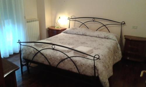 Ένα ή περισσότερα κρεβάτια σε δωμάτιο στο Le Torri Apartments