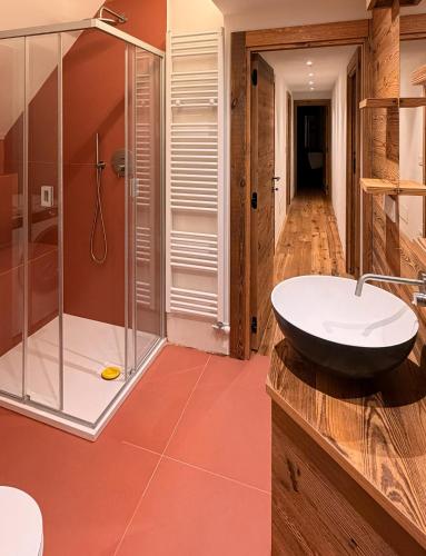 a bathroom with a sink and a shower at Sky nest - Matterhorn in Breuil-Cervinia
