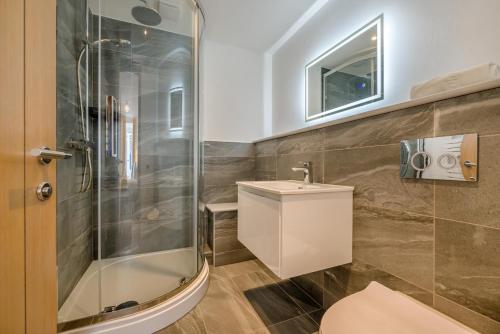 a bathroom with a toilet and a glass shower at 2 Bed in St. Ives oc-e28156 in St Ives