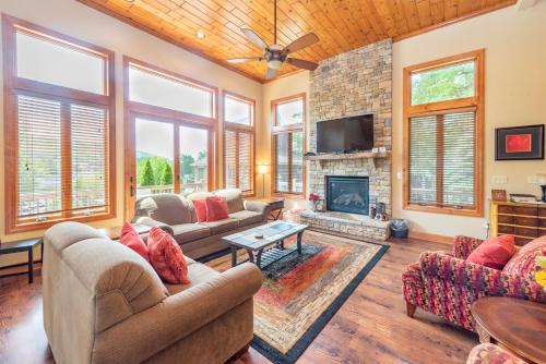 a living room with couches and a fireplace at Firefly Cove by Railey Vacations in McHenry