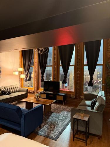 a living room with a view of the city at The Lofts at 107 in Nashville