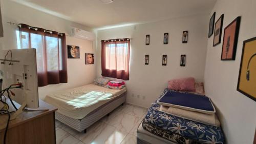 a room with two beds in a room at Jacumã Gold in Conde