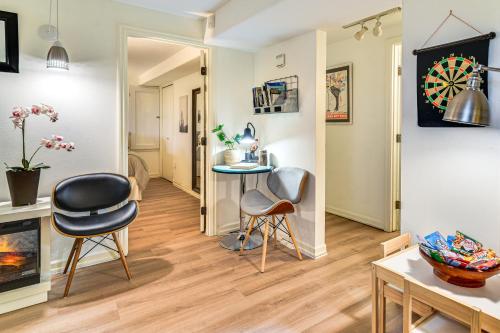 a living room with two chairs and a table at 3 Mi to Downtown Portland Lush Flat with Fire Pit in Portland