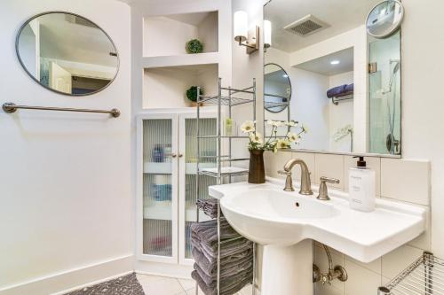 a bathroom with a sink and a mirror at 3 Mi to Downtown Portland Lush Flat with Fire Pit in Portland