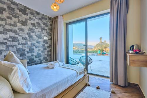 a bedroom with a bed and a large window at Dar Charkaoui Refugio de Silencio & Hospitalidad Familiar in Tétouan